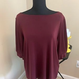 Women’s size large burgundy short sleeve blouse.